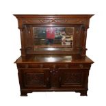 A Victorian Art Nouveau oak mirror back sideboard, the outswept pediment above a rectangular