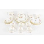 A Mintons porcelain part tea service decorated in the Marlow pattern, comprising teapot, cream