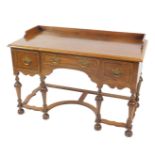 A William & Mary style walnut and mahogany cross banded dressing table, the partially galleried