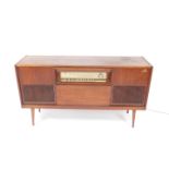 A Grundig teak radiogram, Model KS750GB, the case with radio, record player, concealed speakers