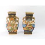 A pair of Satsuma early 20thC vases, of twin handled baluster form, decorated with deities in a