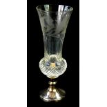 A cut glass and silver vase, of thistle form, engraved with thistles, raised on a silver base,