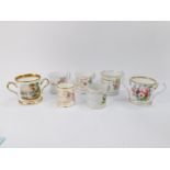 A group of mid 19thC porcelain and pottery mugs and loving cups, gilt presentation dedicated, some