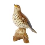 A Beswick figure of a song thrush, modelled perched on a bough, No 2308, impressed marks.