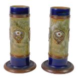 A pair of Royal Doulton late 19thC stoneware vases, of cylindrical form, decorated with Art