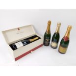 A bottle of Laurent-Perrier Champagne, with chocolates, boxed, together with a bottle of Lanson