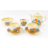 A Clarice Cliff pottery tete-a-tete decorated in the Autumn Crocus pattern, comprising teapot, cream