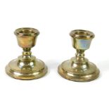 A pair of loaded silver squat candlesticks, of baluster form, Birmingham 1971, 5.52oz all in.