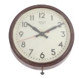 A Smiths Sectric electric wall clock, circular dial bearing Arabic numerals, in a brown Bakelite