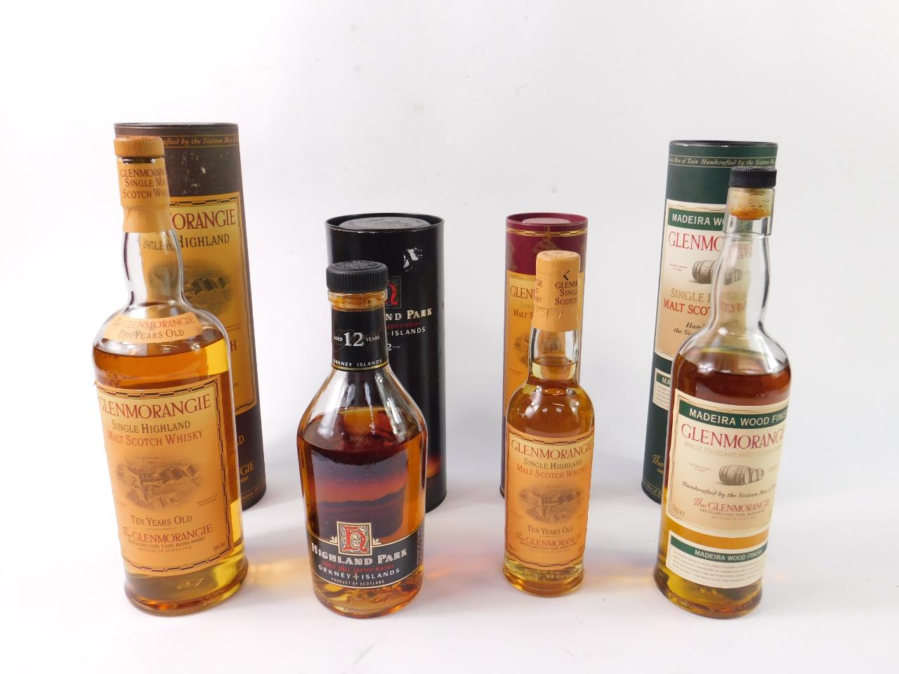 A bottle of Glenmorangie 10 year old single malt whisky, 1ltr, a 70cl bottle of Madeira Wood