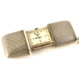 A 1920s silver Movado Ermeto ladies purse watch, having cream dial with Arabic gilt applied numbers,