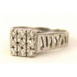 A square design diamond dress ring, the ring set with nine illusion set tiny diamonds, each less