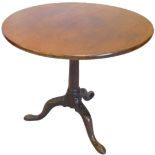 A George III mahogany occasional table, the circular top above a bird cage and turned column with