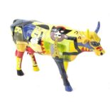 A Cow Parade Clear Lake High School Picowsco's Moosicians figure, 23cm H. (boxed)