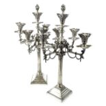 A pair of 20thC silver plated four branch five light candelabra, in near classical style with column