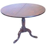 A 19thC walnut occasional table, the circular tilt top on a turned column, tripod base with pad