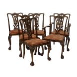 A set of six mahogany dining chair in George III style, each with a pierced splat drop in seat on