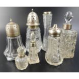 A collection of cut glass and silver mounted items, to include three sugar castors, scent bottles