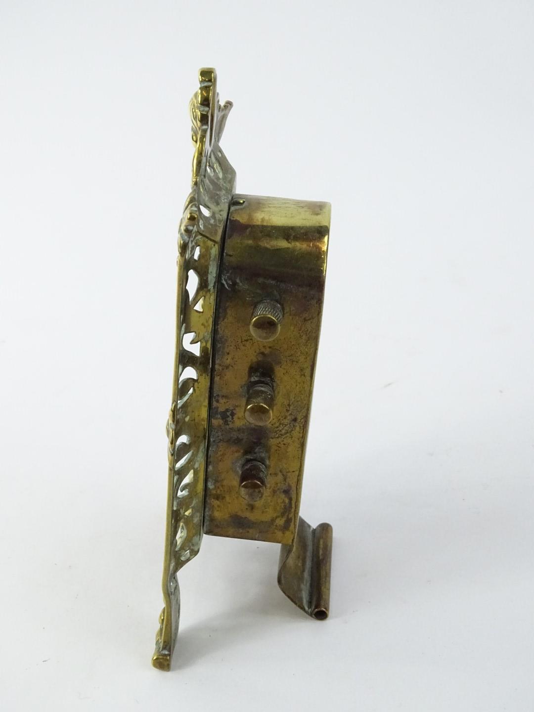 An Edwardian brass desk calendar, with pierced border and revolving drums, 20 cm H. - Image 2 of 2