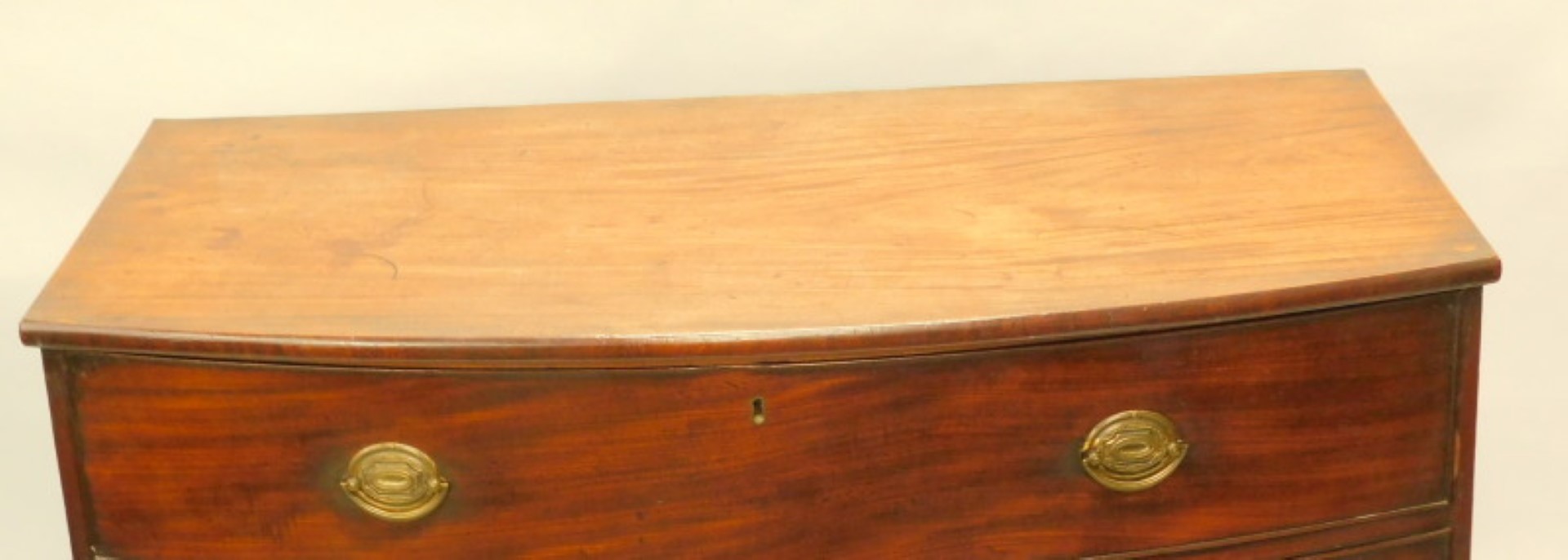 A George III mahogany bow fronted chest of drawers, with a plain top above three long drawers, - Image 3 of 5