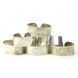 A set of six silver napkin rings, each engraved with the initial C, London 1973, 4¼ oz.