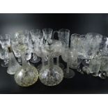 A quantity of cut glass, to include a near pair of cut glass decanters, finger bowls etc.