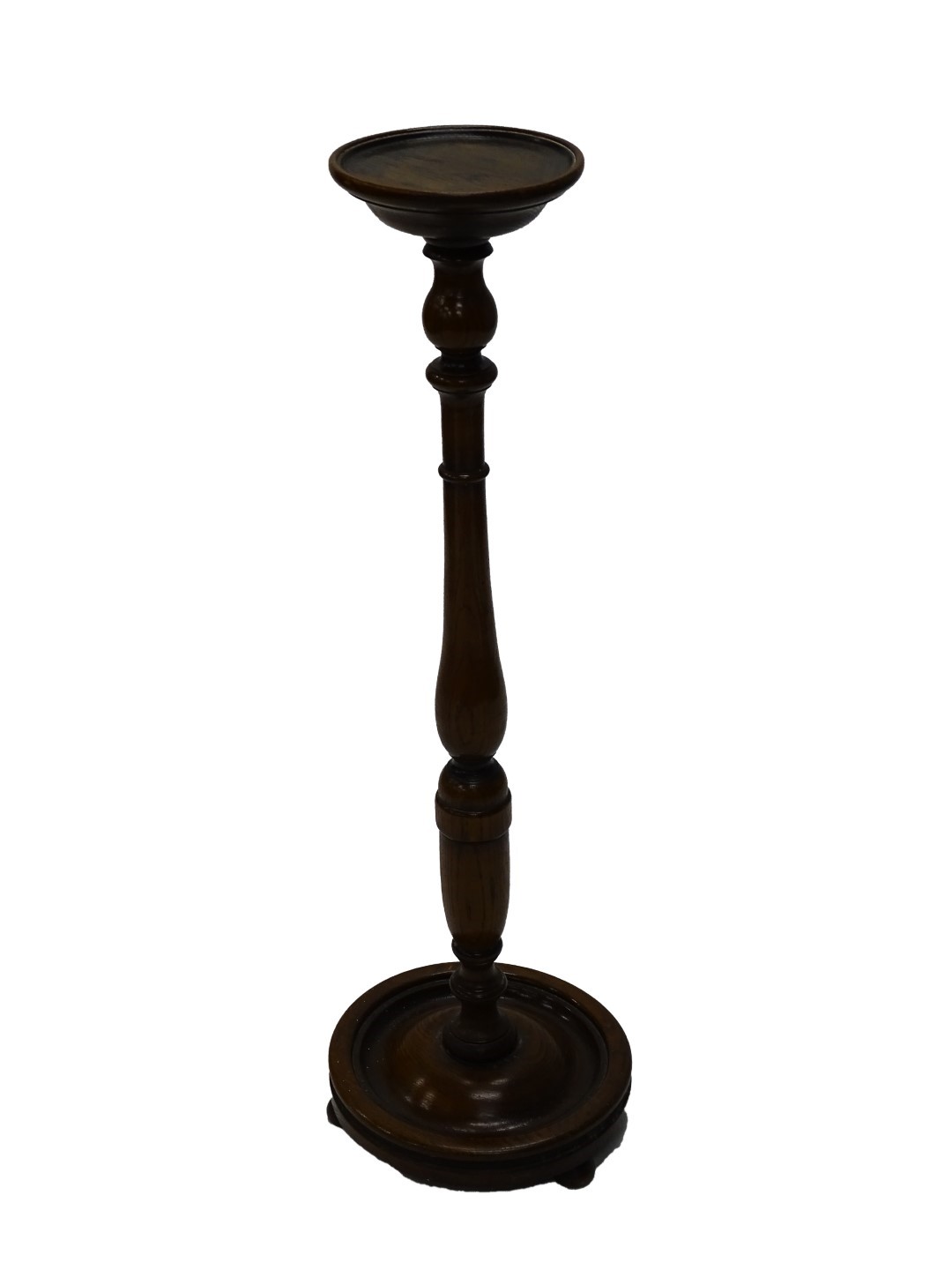 An oak jardinière stand, with turned dish top on baluster turned column and circular base with bun