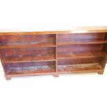 A mahogany open bookcase, with various adjustable shelves, on block feet, 215cm W.