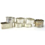 Various shaped napkin rings, to include a canted rectangular and a D shaped example and an