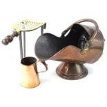 Various early 20thC metalware, comprising a copper coal helmet with swing handle on circular