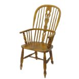 A 19thC ash and elm Windsor chair with a pierced splat, solid seat and 'H' stretcher (AF).