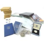 A quantity of commemorative coins, some coins sets, silver presentation coins, etc.