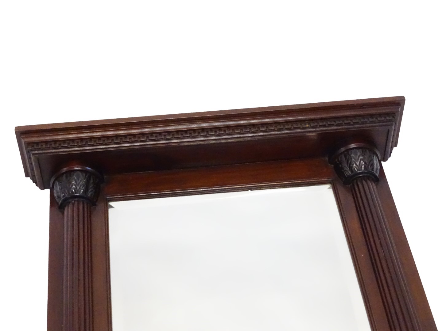 An early 20thC mahogany overmantel mirror, the moulded cornice carved with a Greek key border, above - Image 2 of 2