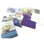 Six five pound commemorative coin sets, and three five pound coin and stamp commemorative sets. (8)