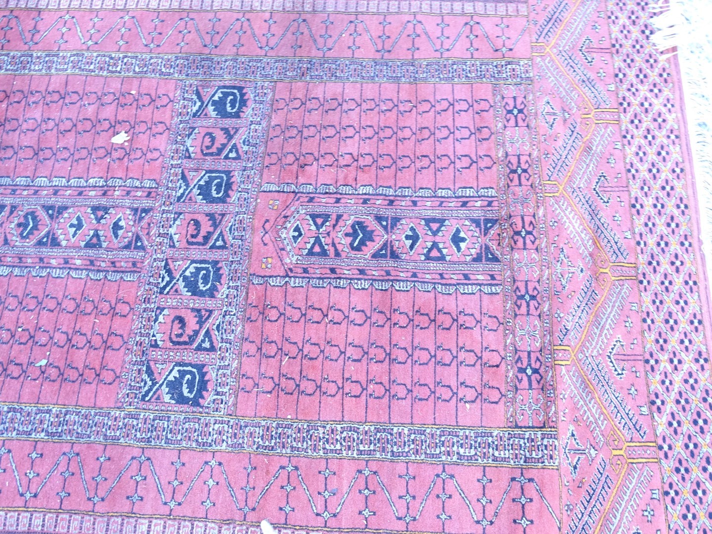 An Afghan style rug, with a central cross design on a deep pink ground with multiple borders, - Image 2 of 3