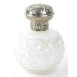 An Edwardian cut glass scent bottle, with hinged silver lid, decorated with angels etc, Birmingham