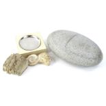 Various items of carved stone, to include an oval sculpture, a carving of a male head, ashtray,