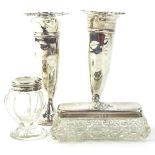 A collection of silver mounted items, to include a pair of early 20thC vases, a cut glass box with