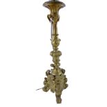 A 19thC carved gilt wood baroque table lamp on three feet.