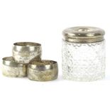 A collection of small silver etc, to include three white metal napkin rings, and a hair tidy with