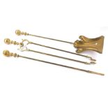 A set of three brass fire implements, each with a turned ball handle.
