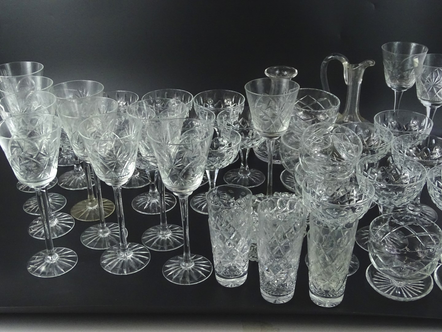 A large quantity of cut glass, a claret jug, wine glasses, tumblers etc.