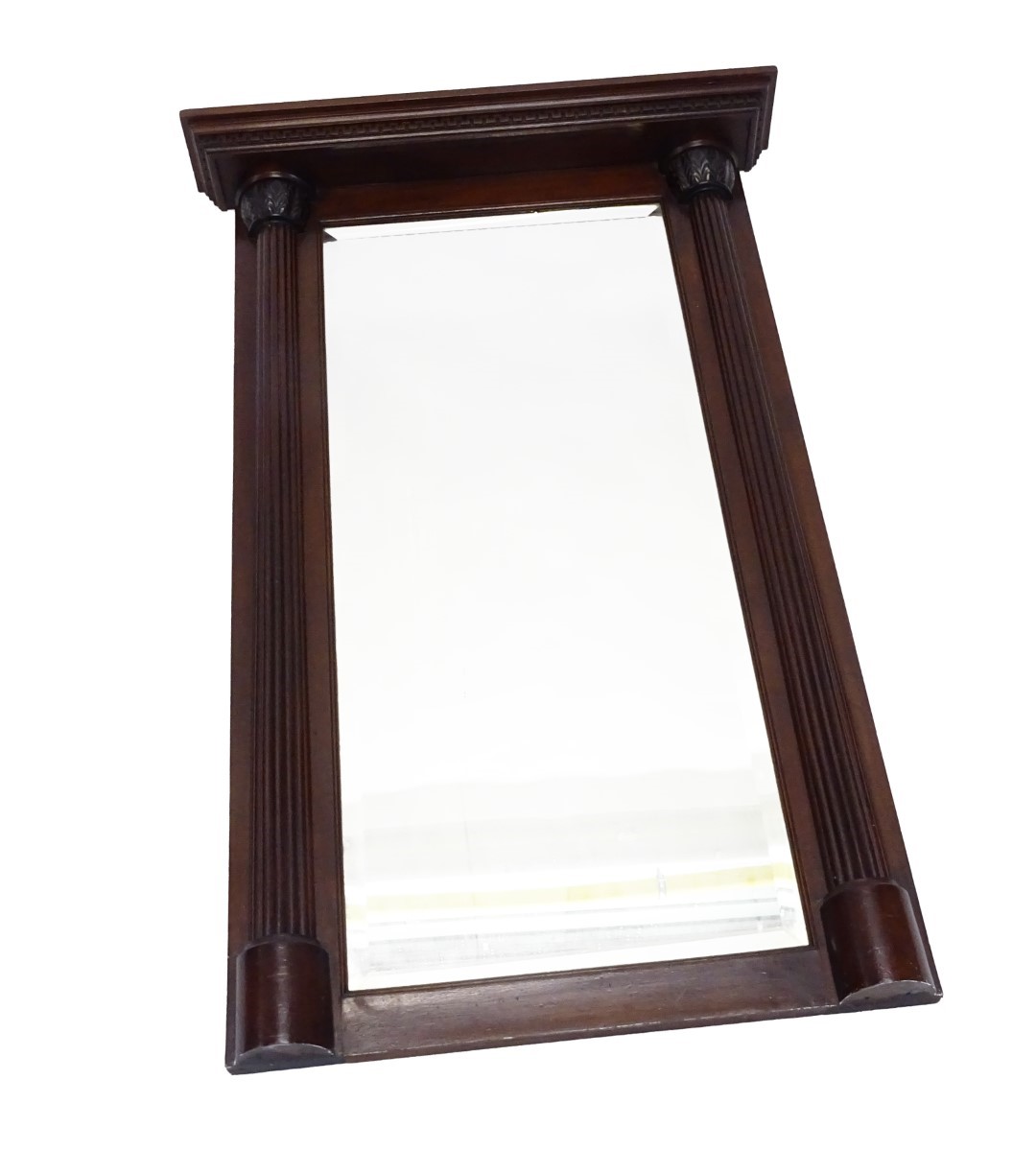 An early 20thC mahogany overmantel mirror, the moulded cornice carved with a Greek key border, above
