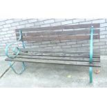 A slatted garden bench, with wrought iron supports, 165cm W.