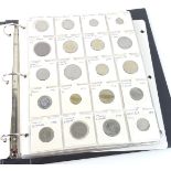 An album containing various foreign coins, some commemorative crowns, bank notes, to include pound