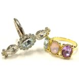 Two Swarovski dress rings, each mounted with three coloured crystals.