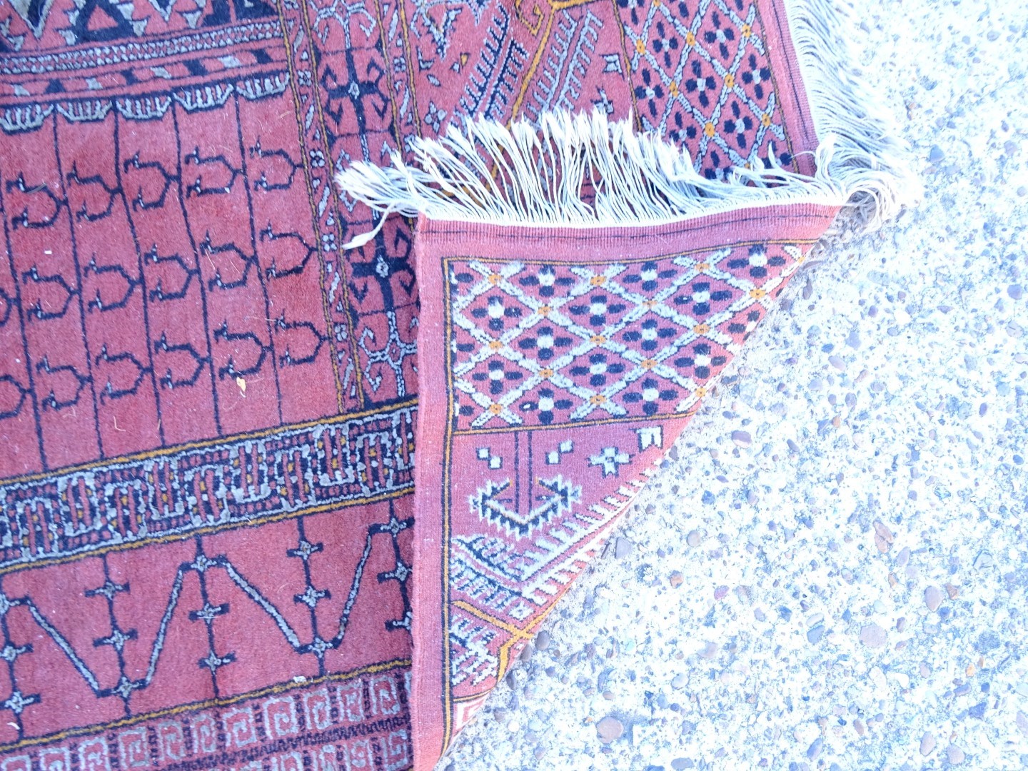 An Afghan style rug, with a central cross design on a deep pink ground with multiple borders, - Image 3 of 3