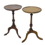 Two similar mahogany wine tables, each with a circular top, turned column and tripod base.