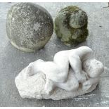 Three garden sculptures, to include a recumbent nude male, a stylised head and another. (3)