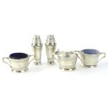 An Edward VIII Sampson and Mordan Art Deco silver five piece cruet, comprising a pair of pepper